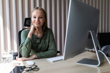 Successful young business woman working at the office