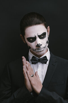 portrait of young man with skull Halloween facepaint