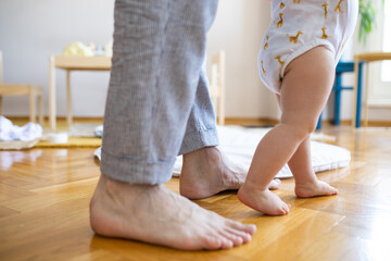 Legs of Baby Making Steps at Home