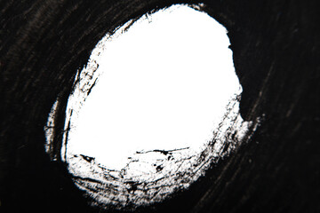 abstract white circle in a frame of black gouache