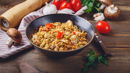 Couscous with turkey, tomatoes, champignon mushrooms and avocado.