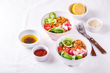 Fresh salad with couscous, tomatoes, cucumber, radish and chard.