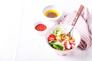 Fresh salad with couscous, tomatoes, cucumber, radish and chard.