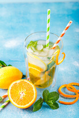 Refreshing cocktails with mint with lemon, orange, mint and ice