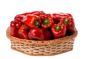 red peppers in wicker basket on isolated white background