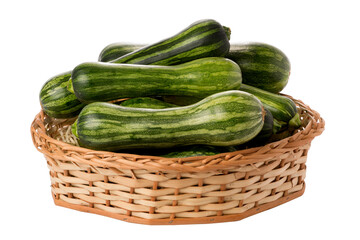 zucchinis in wicker basket on isolated white background