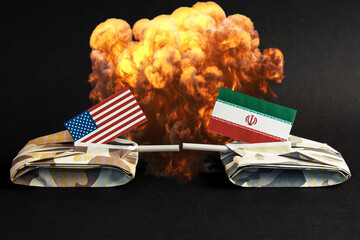 US of America and Iran relations - paper tanks with flags of iran and usa on darck background	