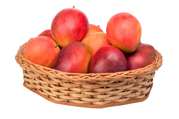 mangoes in wicker basket on isolated white background