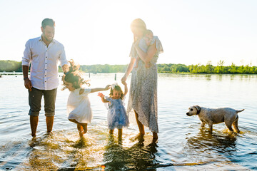 Carefree family playing on beach in summer
