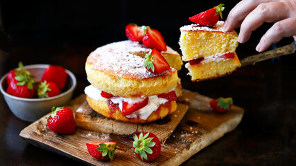 Selective focus. Strawberry Cake Sponge cake with fresh strawberries and cream. Victoria sponge...