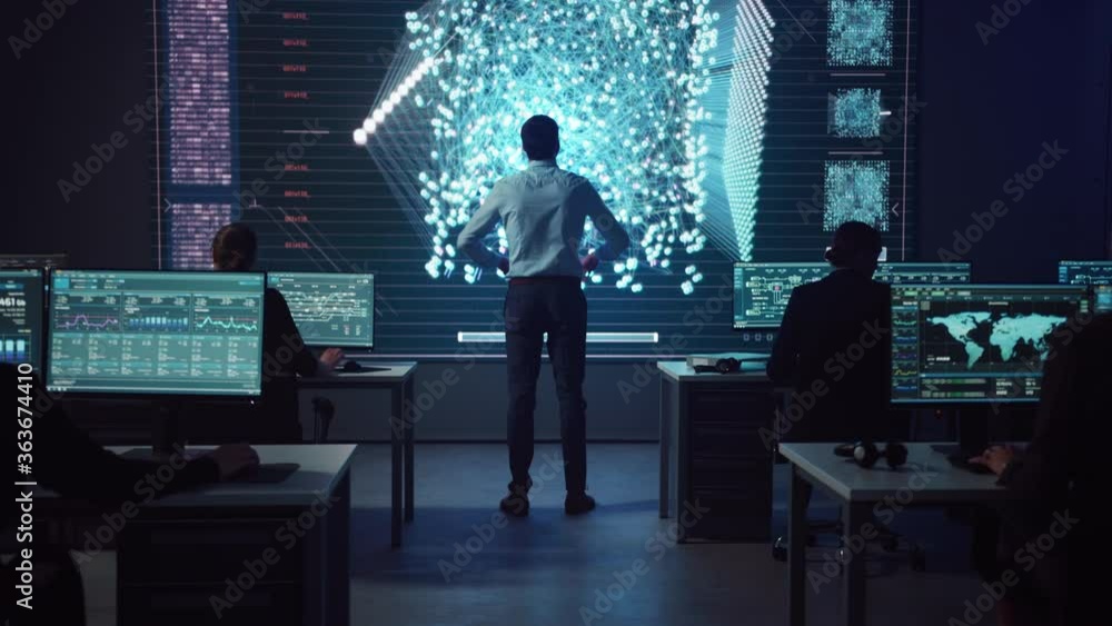 Aufkleber Project manager Walks to a Big Screen with Neural Network. Team of Professional Computer Data Science Engineers Work on Desktops in a Dark System Control and Monitoring Telecommunications Office.