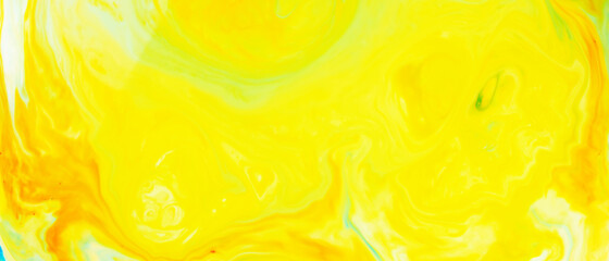 Fluid Art. Abstract blurred colorful background. Swirl liquid pattern. Marble effect of yellow color. Trendy colorful backdrop. Mixing paints