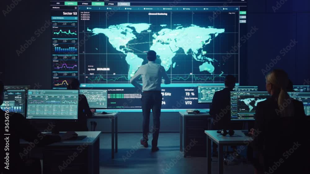 Leinwandbilder Project manager Walks to a Big Screen with Neural Network. Team of Professional Computer Data Science Engineers Work on Desktops in a Dark System Control and Monitoring Telecommunications Office.