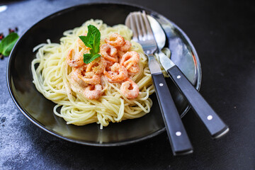 pasta shrimp
spaghetti creamy seafood sauce main dish
food background top view copy space for text
organic healthy eating