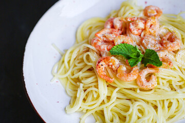 pasta shrimp
spaghetti creamy seafood sauce main dish
food background top view copy space for text
organic healthy eating