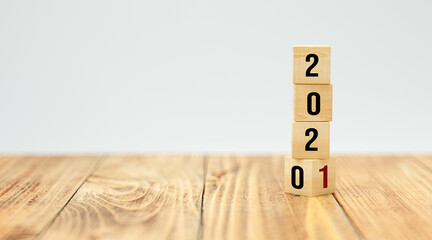 cubes turning from year 2020 to 2021 on white background
