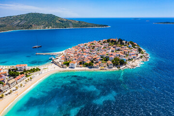 Fototapeta na wymiar Aerial view of Primosten old town, amazing sunny landscape, Dalmatia, Croatia. Famous tourist resort on Adriatic sea coast.