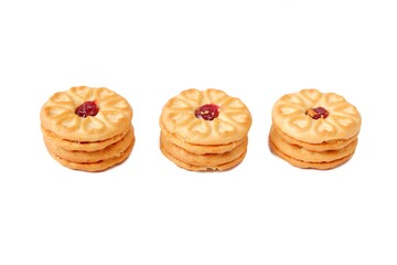 Biscuits filled with strawberry jam, isolated on a white background