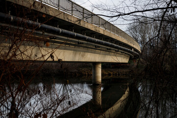olt concrete bridge over the river at down in harvest with refection