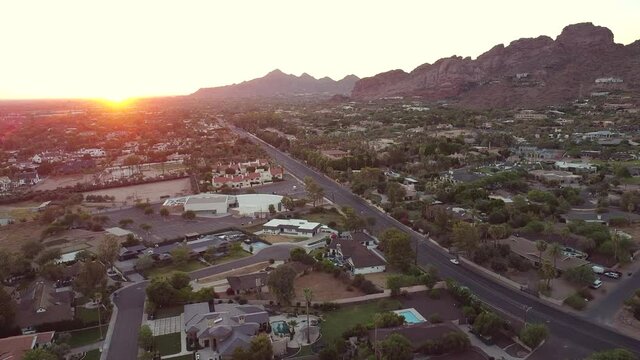 Sun setting over Phoenix Arizona and Camelback Mountain.