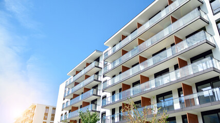 Modern apartment buildings on a sunny day with a blue sky. Facade of a modern apartment building....