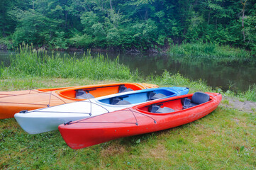 Kayaking trip on the river. Rafting in kayaks. Active recreation on the water.