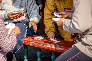playing cards in park in China