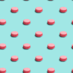 Seamless pattern background with pink french macarons