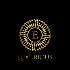 Circle luxury logo with letter E and symmetric swirl shape vector design logo