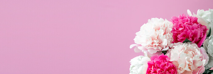 Bouquet beautiful flowers on pink background. Universal greeting card. FLatlay with pionies