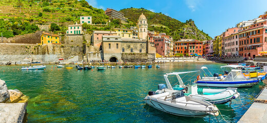 A panorama view across the harbour in the picturesque village of Vernazza in the summertime