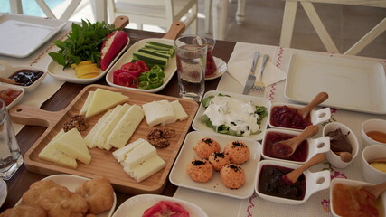 Concept promotional morning breakfast in the hotel, tasty Egg Benedict,Turkish and French Breakfast, tea and orange juice. near swimming pool	