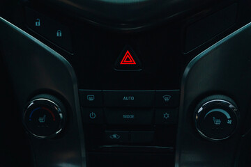 dashboard in a car with emergency lights on