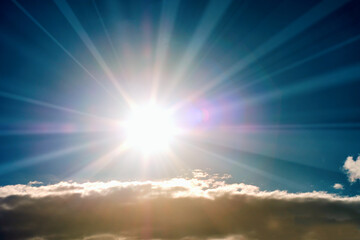Fototapeta na wymiar Shining sun at clear blue sky