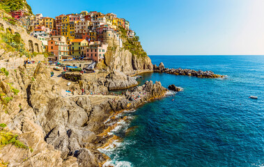 A view along the coast towards the village of Manarola, Cinque Terre, Italy in the summertime