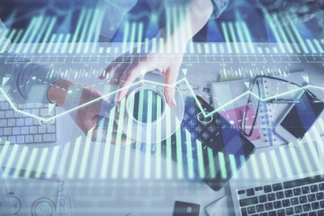 Double exposure of man and woman working together and data theme hologram drawing. Computer background. Top View.