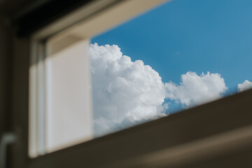 window view of high cumulonimbus clouds