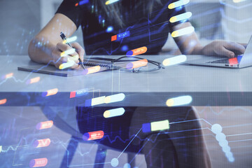 Multi exposure of woman hands working on computer and data theme hologram drawing. Tech concept.