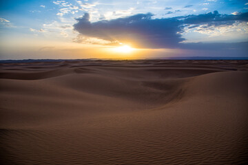 Naklejka na ściany i meble Scenic View Of Desert Against Sky During Sunset