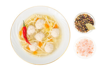 Broth with noodles and meat balls. Photo