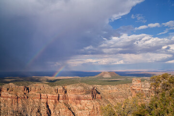 Double rainbow over the Grand Canyon as the sun breaks through the passing storm - Powered by Adobe