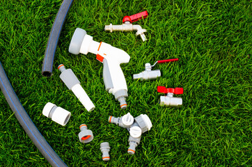 Plastic, watering can, hose for watering the garden, lawn.