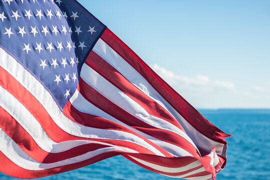 American Flag Waving in the Wind While on the Water