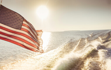 American Flag Waving in the Wind While on the Water