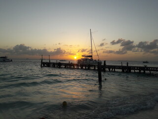 Fototapeta premium Sunset at beach with a dock on Isla Mujeres Cancun Mexico 2020