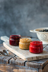 jars of black, red and yellow currant jam