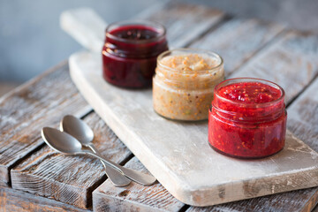 jars of black, red and yellow currant jam