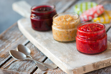 jars of black, red and yellow currant jam
