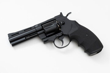 Black revolver gun isolated on the white background.
