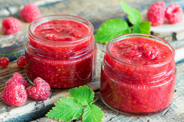 raspberry and currant jam in small jars